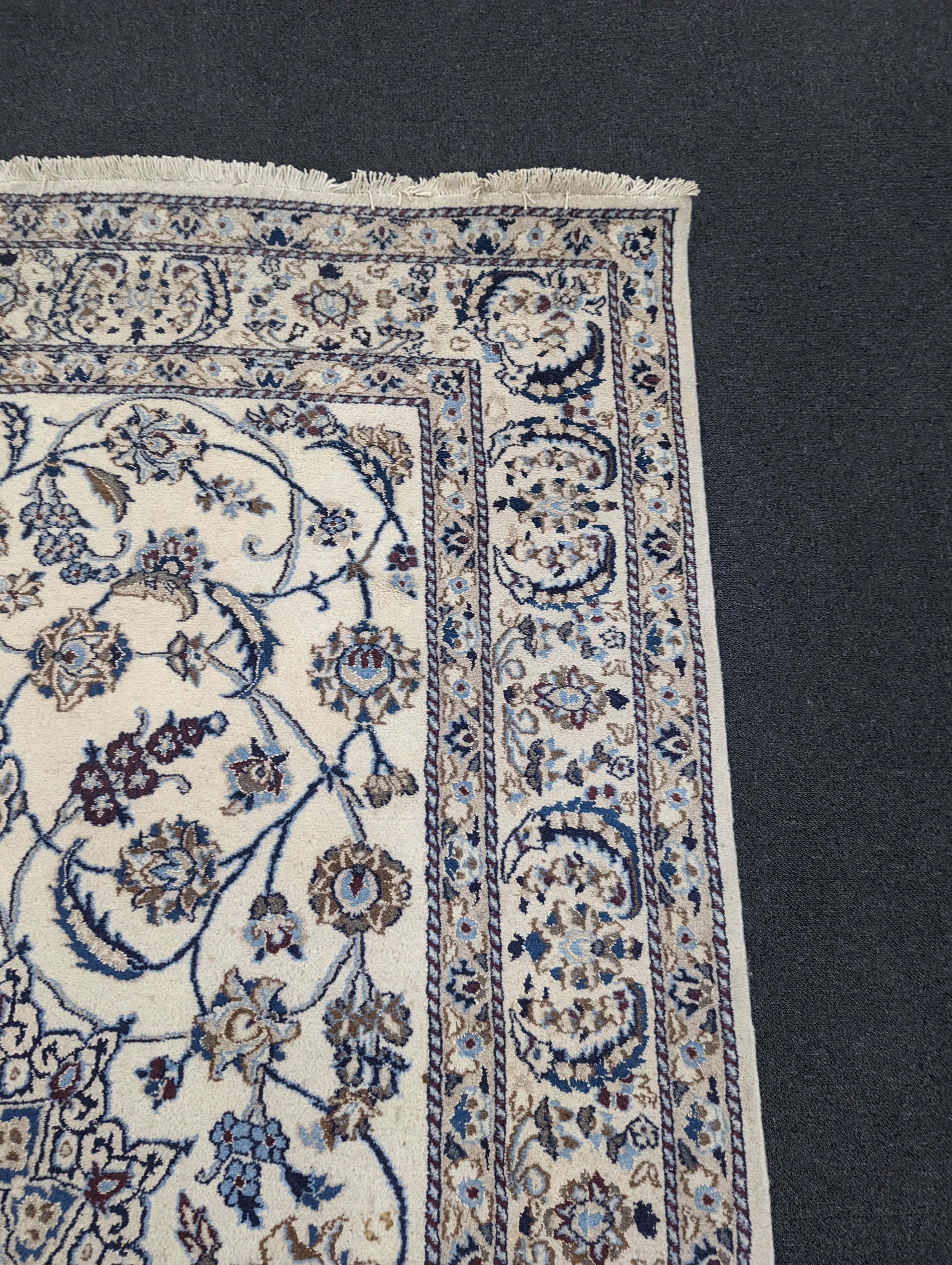 An ivory ground Nain carpet, 290 x 205cm